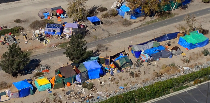 Aerial view of tents lining a bike path